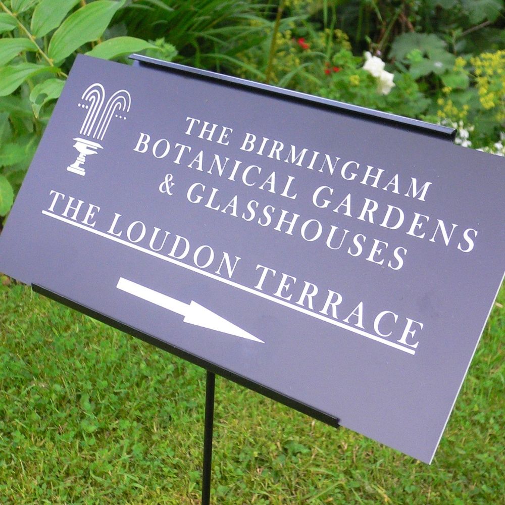 Engraved botanical gardens logo label with matching label holder mounted for outdoor signage