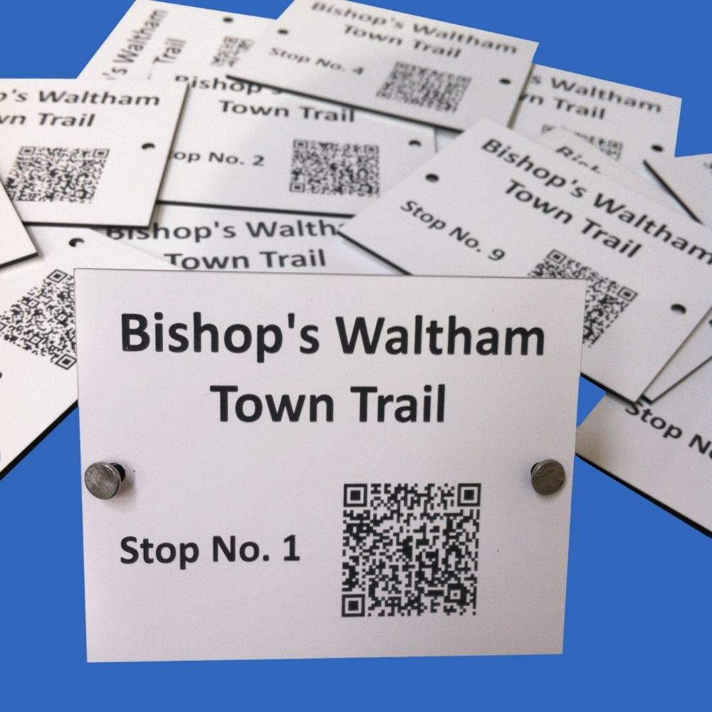 Weather-resistant white trail label with laser engraved QR code and text